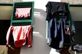 Laundry drying on green folding shutters