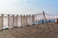 Laundry drying on rope on Ghat in sunny day . Varanasi. India Royalty Free Stock Photo