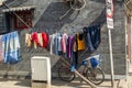 Laundry hanging for air drying in a small hutong alley in Beijing, China