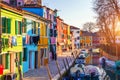 Laundry hanging out of typical houses of Burano Island, Venice, Italy. Multicolored buildings and laundry drying on the street in Royalty Free Stock Photo