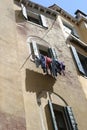 Laundry hanging outside the window Royalty Free Stock Photo