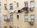 Laundry hanging from a thread in the window of a building in a district of Madrid, Spain Royalty Free Stock Photo