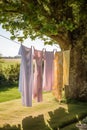 Laundry, housekeeping and homemaking, fresh clean clothes and linen drying outdoors in the garden, country cottage style, Royalty Free Stock Photo