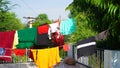 Laundry line with clothes on green tree background. Laundry drying on the roof Royalty Free Stock Photo