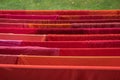 Laundry rack in the garden with drying red clothes and towels Royalty Free Stock Photo