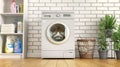 Laundry room on a brick wall background with detergents and a basket.