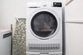 Laundry room with electric dryer