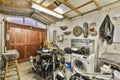 the laundry room has a washing machine and a motorcycle Royalty Free Stock Photo