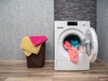 Laundry room interior with washing machine against the wall. Royalty Free Stock Photo