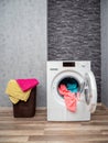 Laundry room interior with washing machine against the wall. Royalty Free Stock Photo