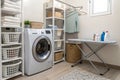 Laundry room interior with washing machine near wall Royalty Free Stock Photo