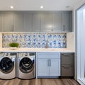 15 A laundry room with a mix of white and blue finishes, a large, graphic tile backsplash, and a mix of open and closed storage4