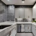 11 A laundry room with a mix of white and gray finishes, a large, graphic tile backsplash, and a mix of open and closed storage1