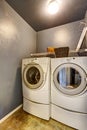 Laundry room with tile floor, washer, and dryer. Royalty Free Stock Photo
