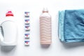 Laundry set with towels and plastic bottels on white background top view Royalty Free Stock Photo