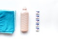 Laundry set with towels and plastic bottels on white background top view Royalty Free Stock Photo