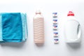 Laundry set with towels and plastic bottels on white background top view Royalty Free Stock Photo