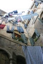 Laundry on clotheslines between two buildings Royalty Free Stock Photo