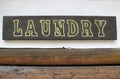 Laundry sign attached to a wall