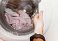 Laundry. wash clothes in the washing machine.getting clothes out of the wash Royalty Free Stock Photo