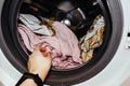 Laundry. wash clothes in the washing machine.getting clothes out of the wash Royalty Free Stock Photo
