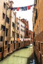 Laundry hanging out to dry on ropes over canal, Venice, Italy Royalty Free Stock Photo