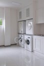 Laundry washing machine and dryer against modern appliance household in laundry room