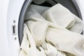 Laundry. Washing machine and a pile of dirty clothes at home. Royalty Free Stock Photo