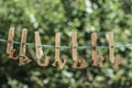 LAUNDRY word written by hanged wooden letters on rope at garden