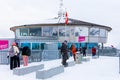 Tourists observing on deck of Schilthorn building after snowfall Royalty Free Stock Photo
