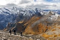 Tourists hiking on the Schilthorn Ridge at the summit of Schilthorn mountain of the Swiss Alps in Switzerland