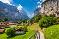 Lauterbrunnen valley with famous church and Staubbach waterfall. Lauterbrunnen village, Berner Oberland, Switzerland, Europe.