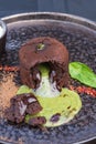 lava cake. Chocolate fondant with basil ganache. Traditional dessert of French cuisine with author\'s filling
