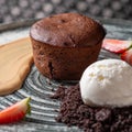 Lava cake with vanilla sauce with fresh strawberries, ice-cream ball Royalty Free Stock Photo