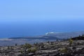 Lava fields on the Big Island in Hawaii with the Pacific Ocean in the background Royalty Free Stock Photo