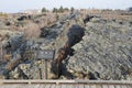 Lava field in Wudalianchi Global geopark in Northern China in cloudy weather. A piece of lava rascality into two parts by zipper