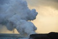 Lava flowing into sea Royalty Free Stock Photo