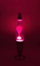 Lava lamp lavalamp red purple volcano color isolated retro vintage style from the 1960s and 1970s, hippie peace generation Royalty Free Stock Photo