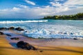 Lava rock, golden sand, white foam, napili bay, maui Royalty Free Stock Photo