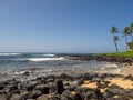 Lava rocks along beautiful Poipu Beach