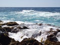 Lava rocks and wild ocean on the west coast of the island Sao Miguel, Azores, Portugal.