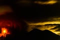 Lava spurts from erupting Fuego volcano next to Acatenango volcano in Guatemala Royalty Free Stock Photo