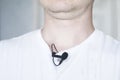 Lavalier microphone is attached to a T-shirt