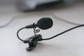 The lavalier microphone lies on a table