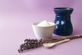 Lavander spa, salty scrub in ceramic bowl, blue aroma lamp