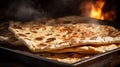 Lavash bread, a thin, soft, and flexible flatbread, resembles a pale, parchment-like sheet