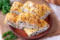 Lavash roll with cottage cheese and greens on a plate Royalty Free Stock Photo