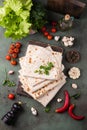 Lavash rolled on a wooden background, thin traditional oriental bread, Armenian flatbread, top view Royalty Free Stock Photo