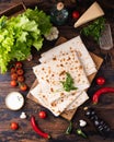 Lavash rolled on a wooden background, thin traditional oriental bread, Armenian flatbread, top view Royalty Free Stock Photo