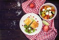 Lavash rolls with meet, vegetables and cheese served with green